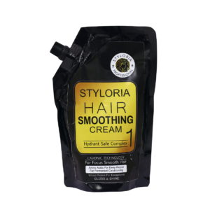 A black pouch with golden square background with title written "Styloria Hair Smoothing Cream 1" and the Styloria Brand Logo on the top right side of the pouch